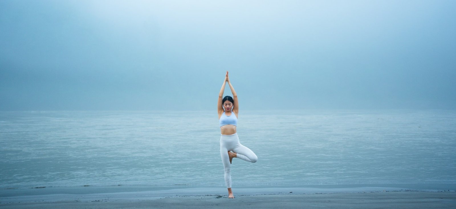 girl doing tree yoga pose