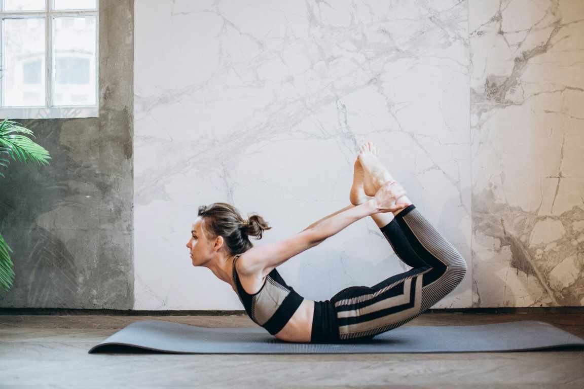 girl doing bow yoga pose