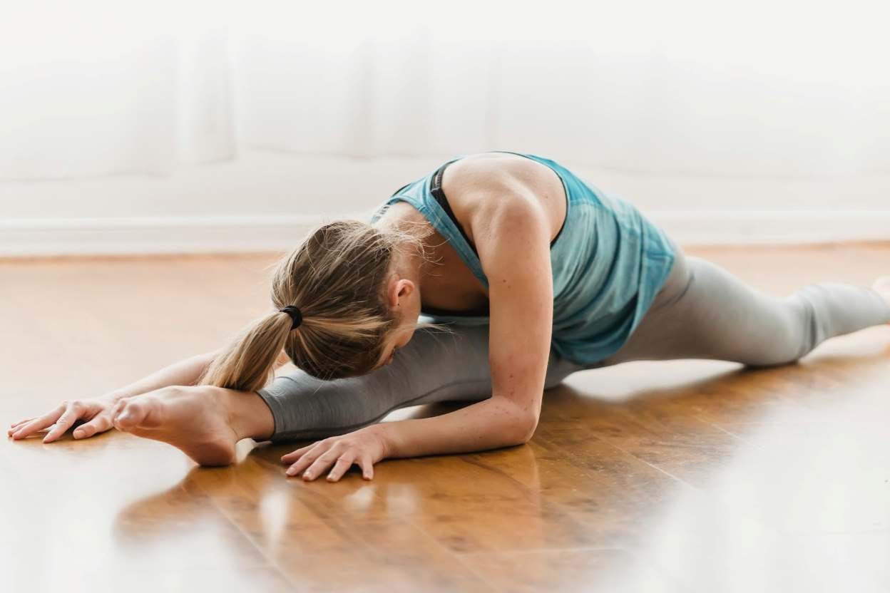 girl doing yoga to stay healthy